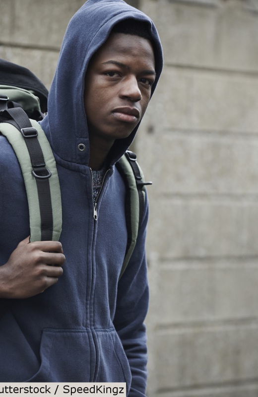 Young man with rucksack | Shutterstock, SpeedKingz